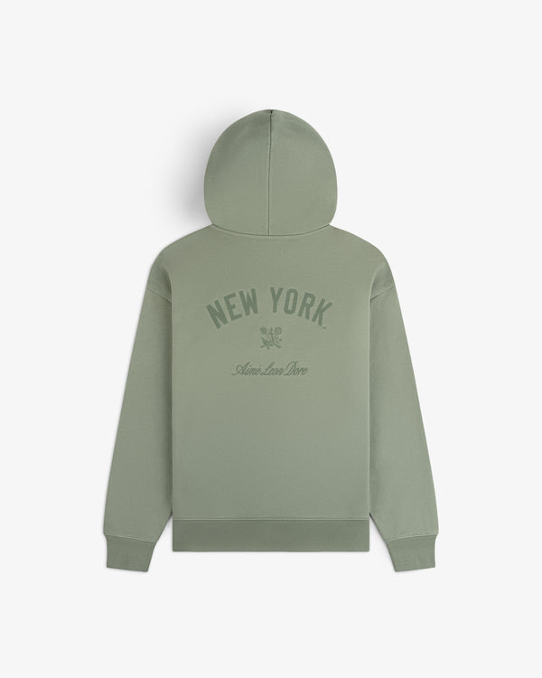 Yankees Washed Full-Zip Hoodie in sage green with NEW YORK and Aimé Leon Dore text, shown on a white background.