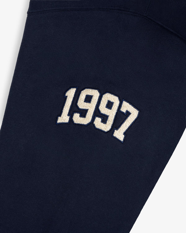 Mulberry Letterman Hoodie in navy blue with “1997” embroidered in white and outlined in black.