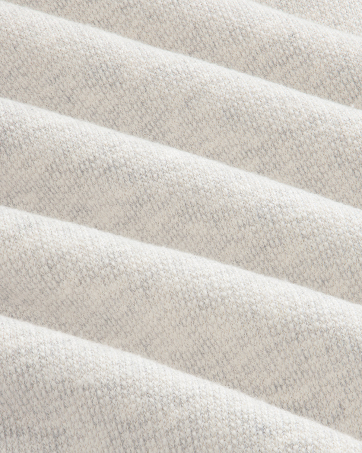 Close-up of soft, light gray ribbed fabric from Stone Washed Marina Sweatpants with subtle knit and diagonal ridges.
