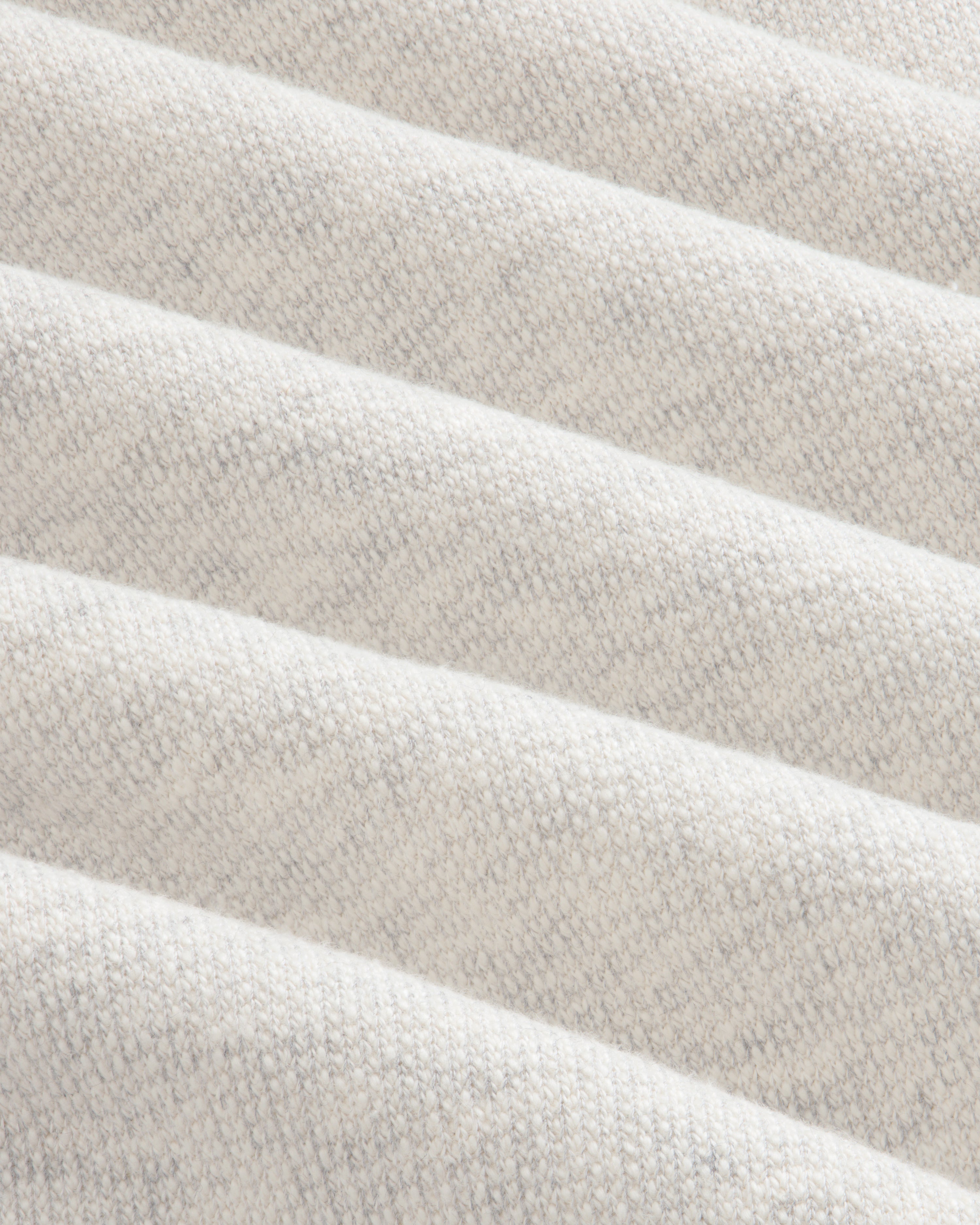 Close-up of soft, light gray ribbed fabric from Stone Washed Marina Sweatpants with subtle knit and diagonal ridges.