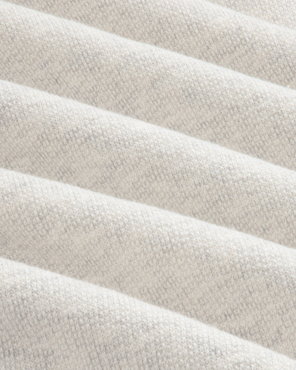 Close-up of soft, light gray ribbed fabric from Stone Washed Marina Sweatpants with subtle knit and diagonal ridges.