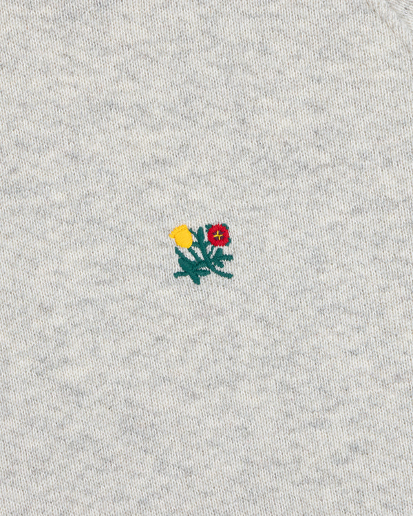 Colorblock Crest Snap Hoodie in light gray heathered fabric with an embroidered yellow and red flower design.