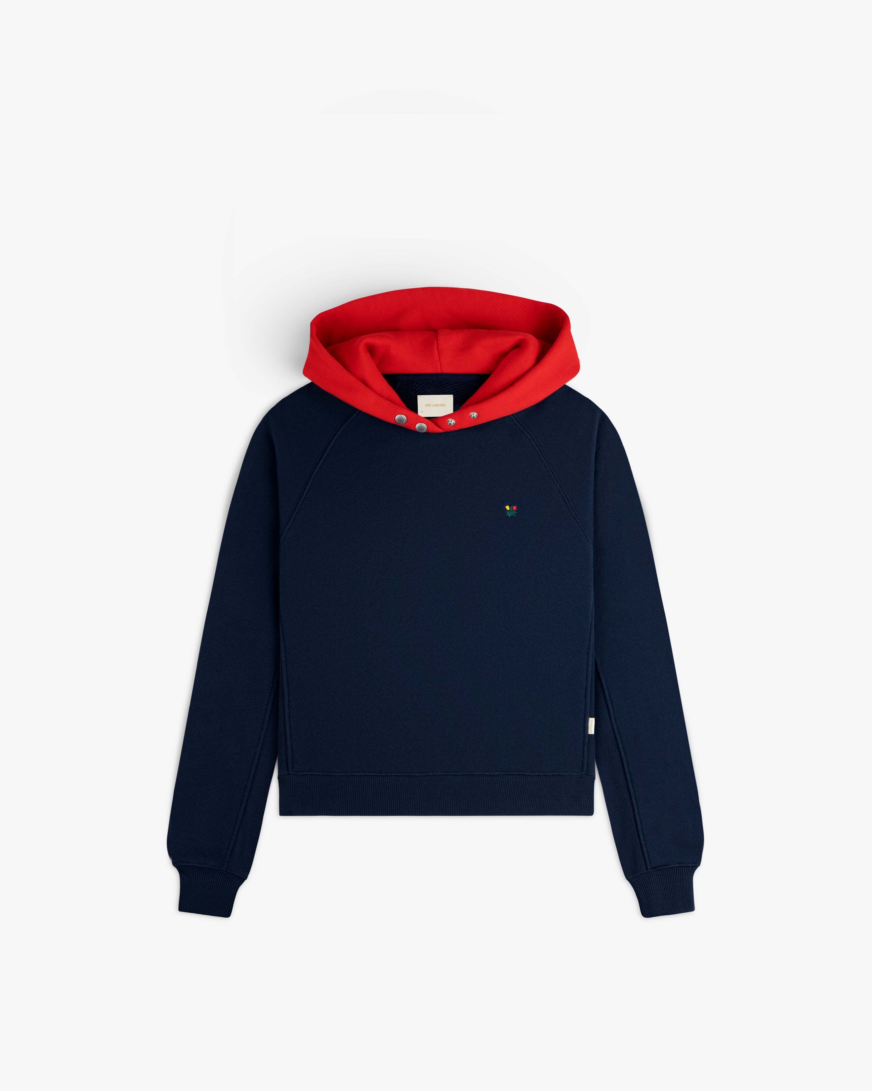 Colorblock Crest Snap Hoodie in navy blue with a bright red hood and two snaps at the neckline.