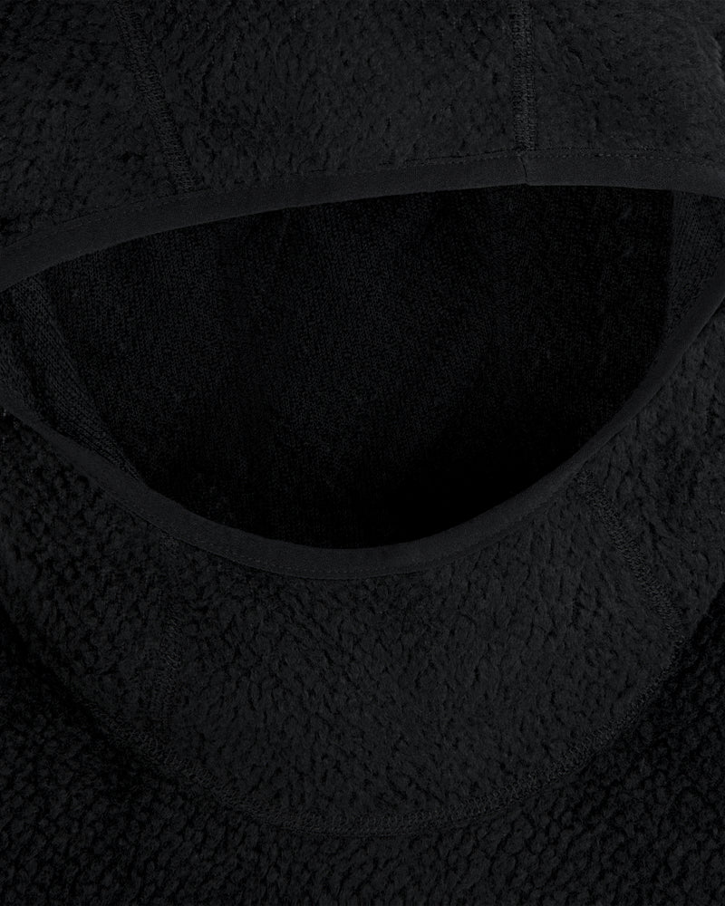 Close-up of a black textured Fleece Performance Hoodie hood with smooth fabric trim.