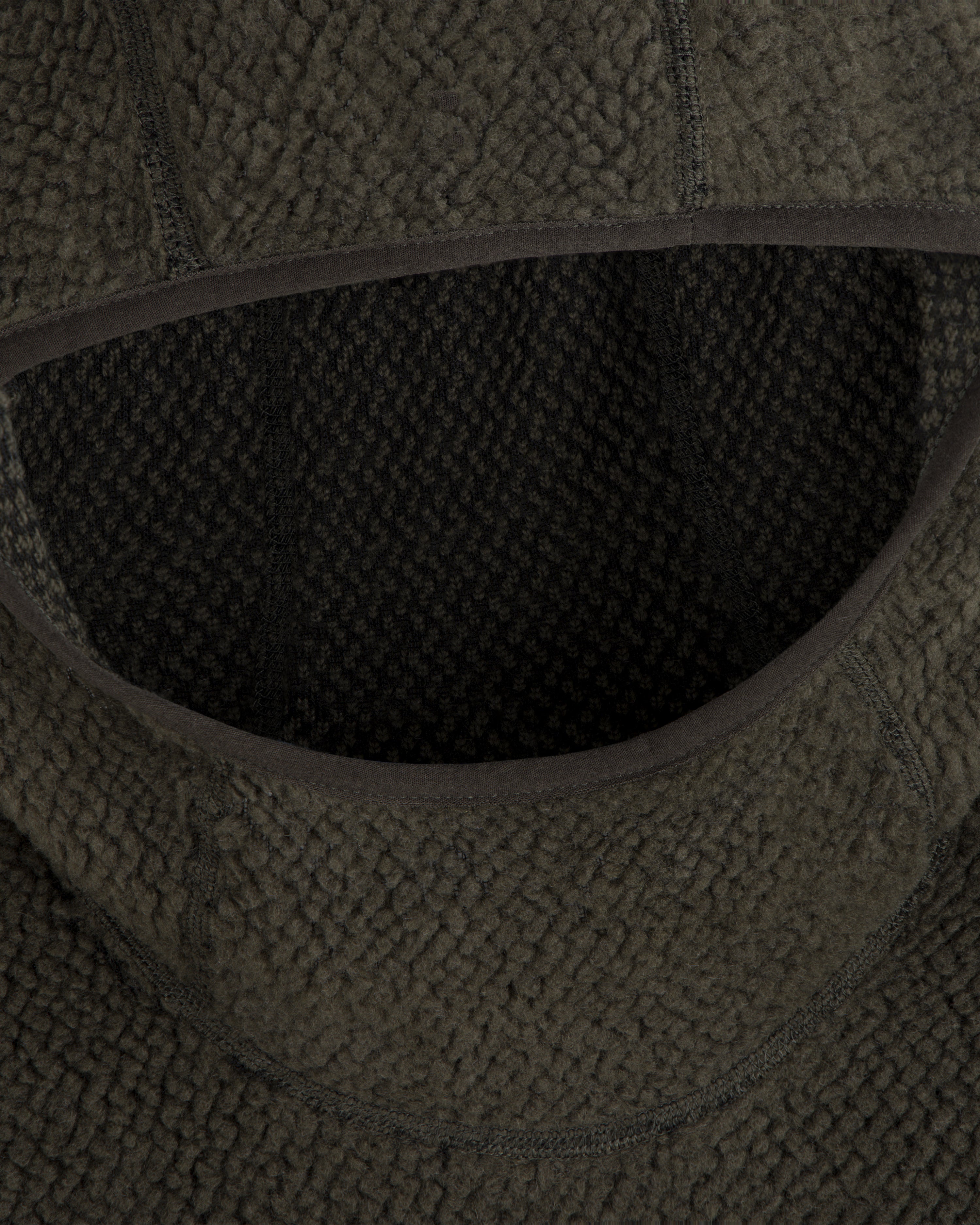 Close-up of a dark green Fleece Performance Hoodie featuring a textured, nubby finish around the hood opening.