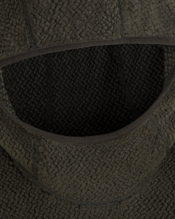 Close-up of a dark green Fleece Performance Hoodie featuring a textured, nubby finish around the hood opening.