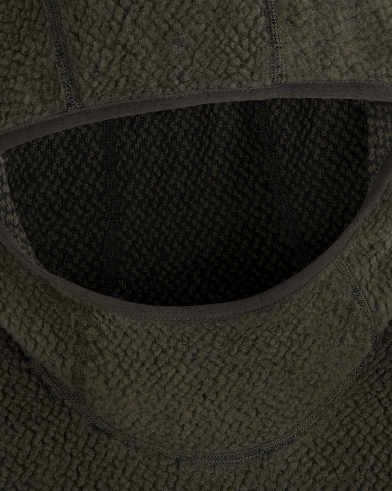 Close-up of a dark green Fleece Performance Hoodie featuring a textured, nubby finish around the hood opening.