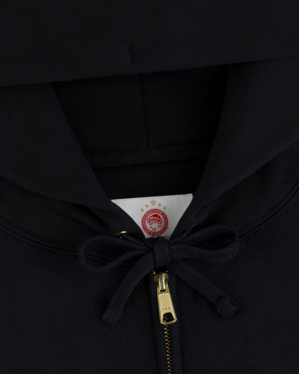 Black ALD / Olympiacos F.C. Full Zip Hoodie with a red and gold circular emblem on the inner collar label.