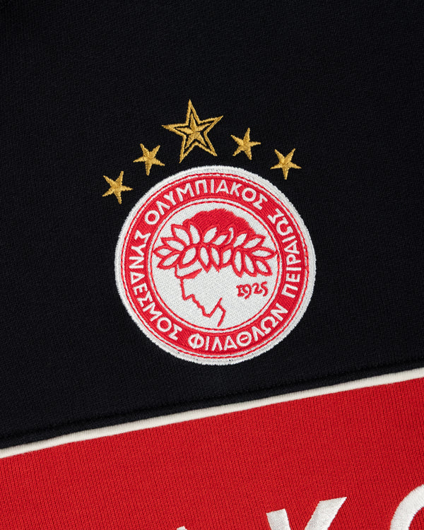 ALD / Olympiacos F.C. Full Zip Hoodie with an embroidered crest patch featuring a laurel-crowned head and five gold stars.