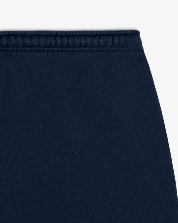 Close-up of the elasticized waistband on the navy blue Script Sweatpant.