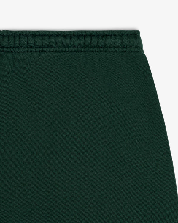 Close-up of the dark green elastic waistband of the Script Sweatpant.