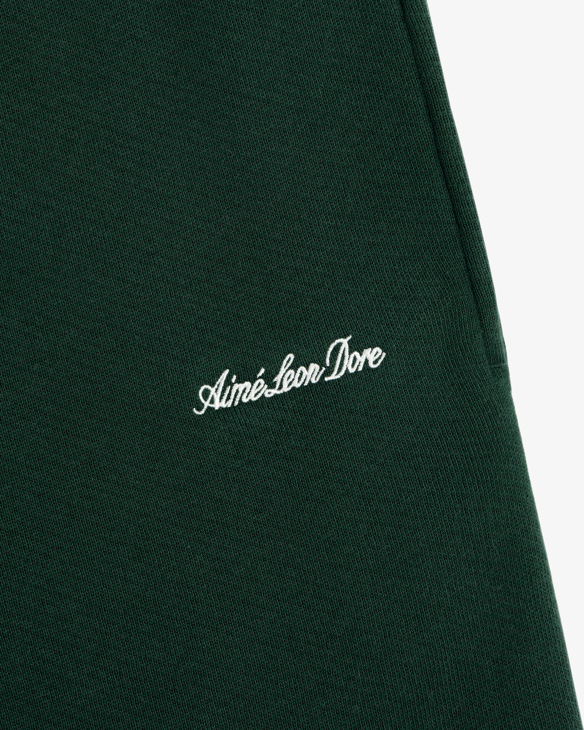 Dark green Script Sweatpant featuring white cursive script embroidery.