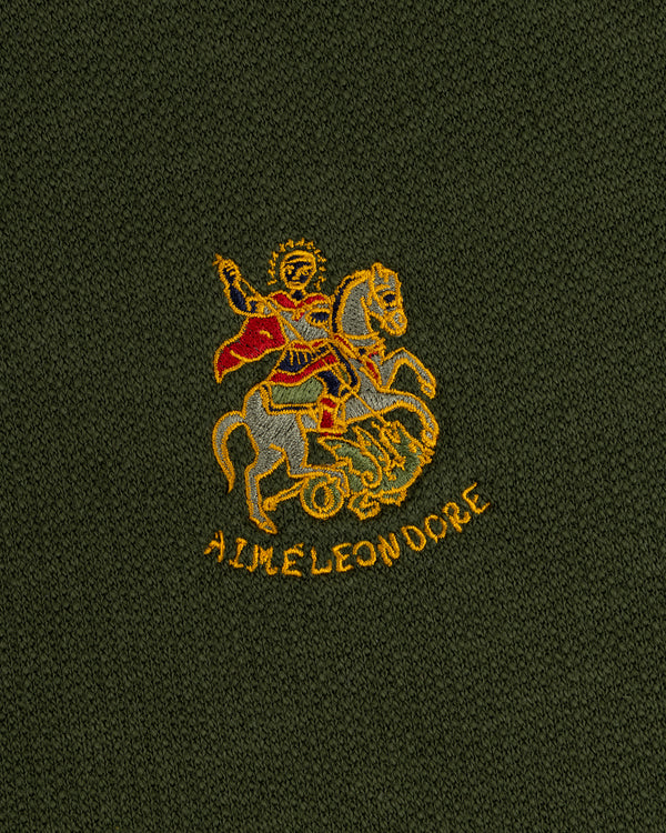 Saint George Track Jacket with embroidered knight and AIME LEON DORE text on dark green fabric.