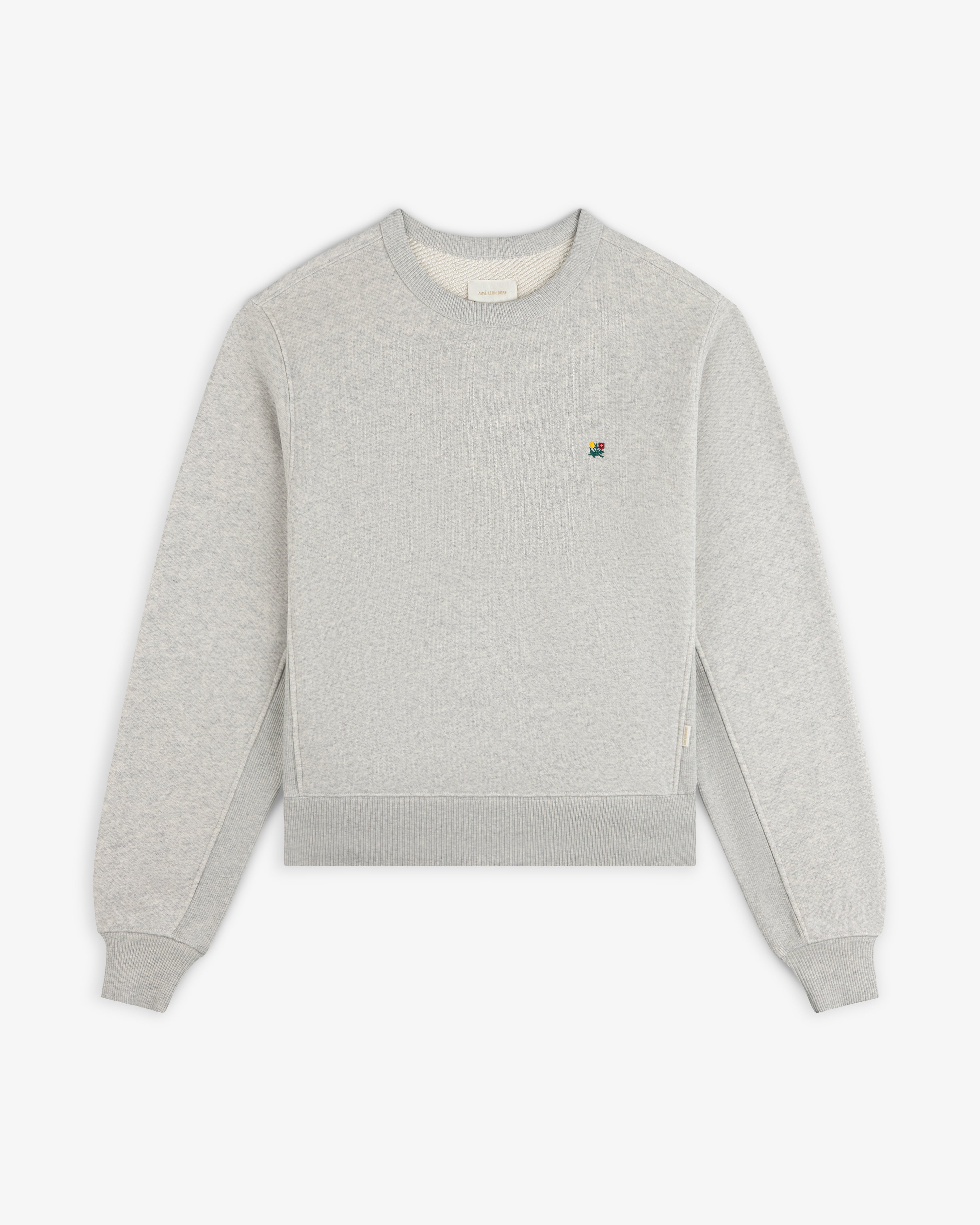 Light gray Crest Crewneck Sweatshirt featuring a small, colorful embroidered logo on the chest.