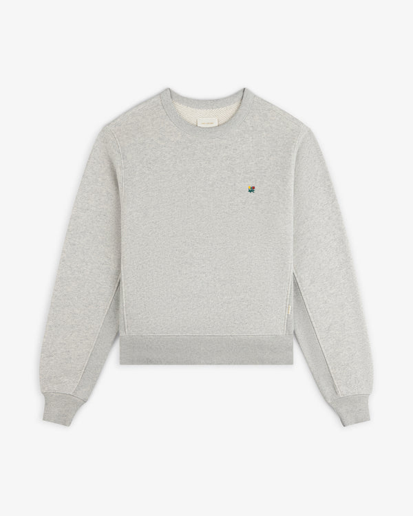 Light gray Crest Crewneck Sweatshirt featuring a small, colorful embroidered logo on the chest.