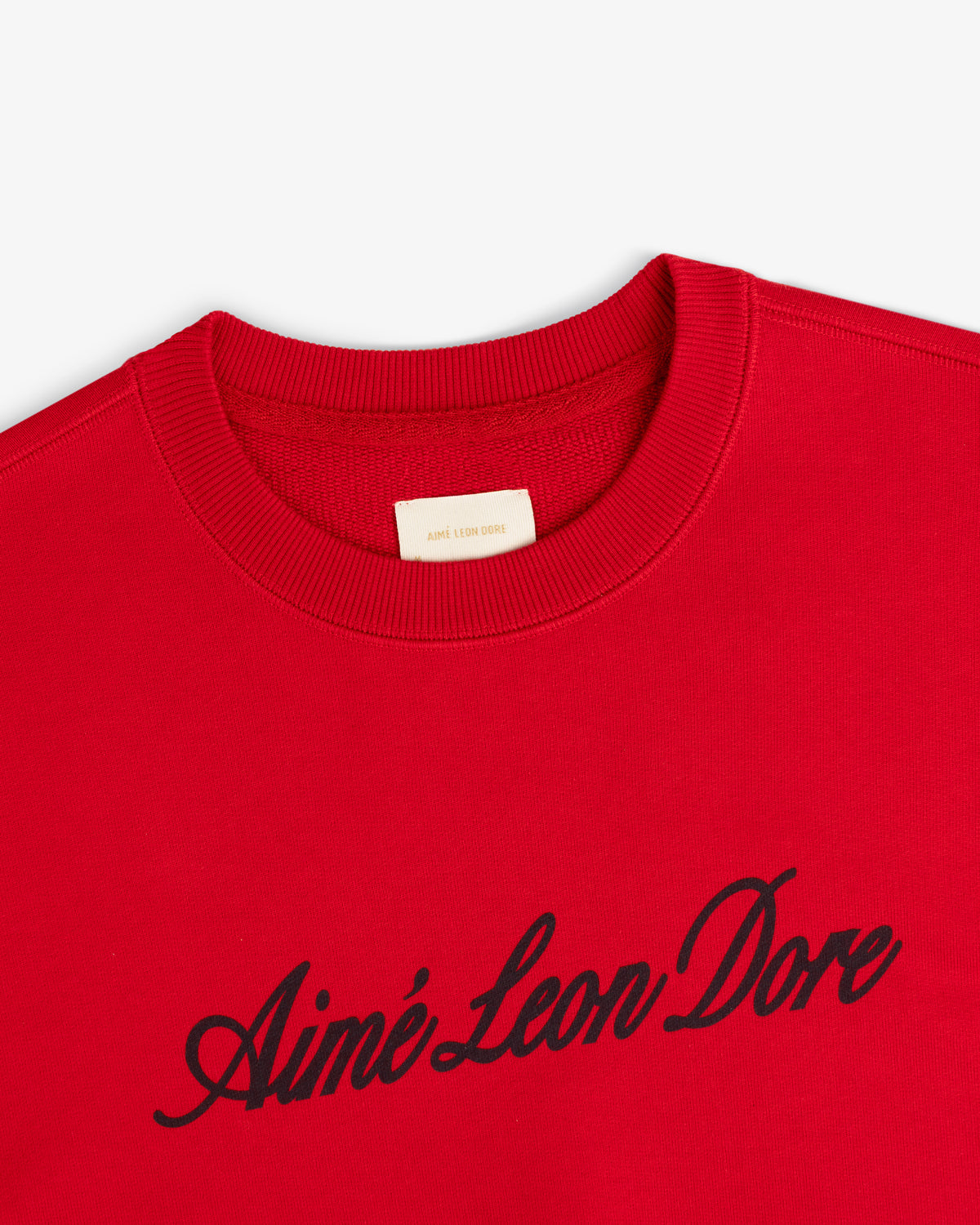 Vintage Script Crewneck Sweatshirt in red with black Aimé Leon Dore script across the chest.