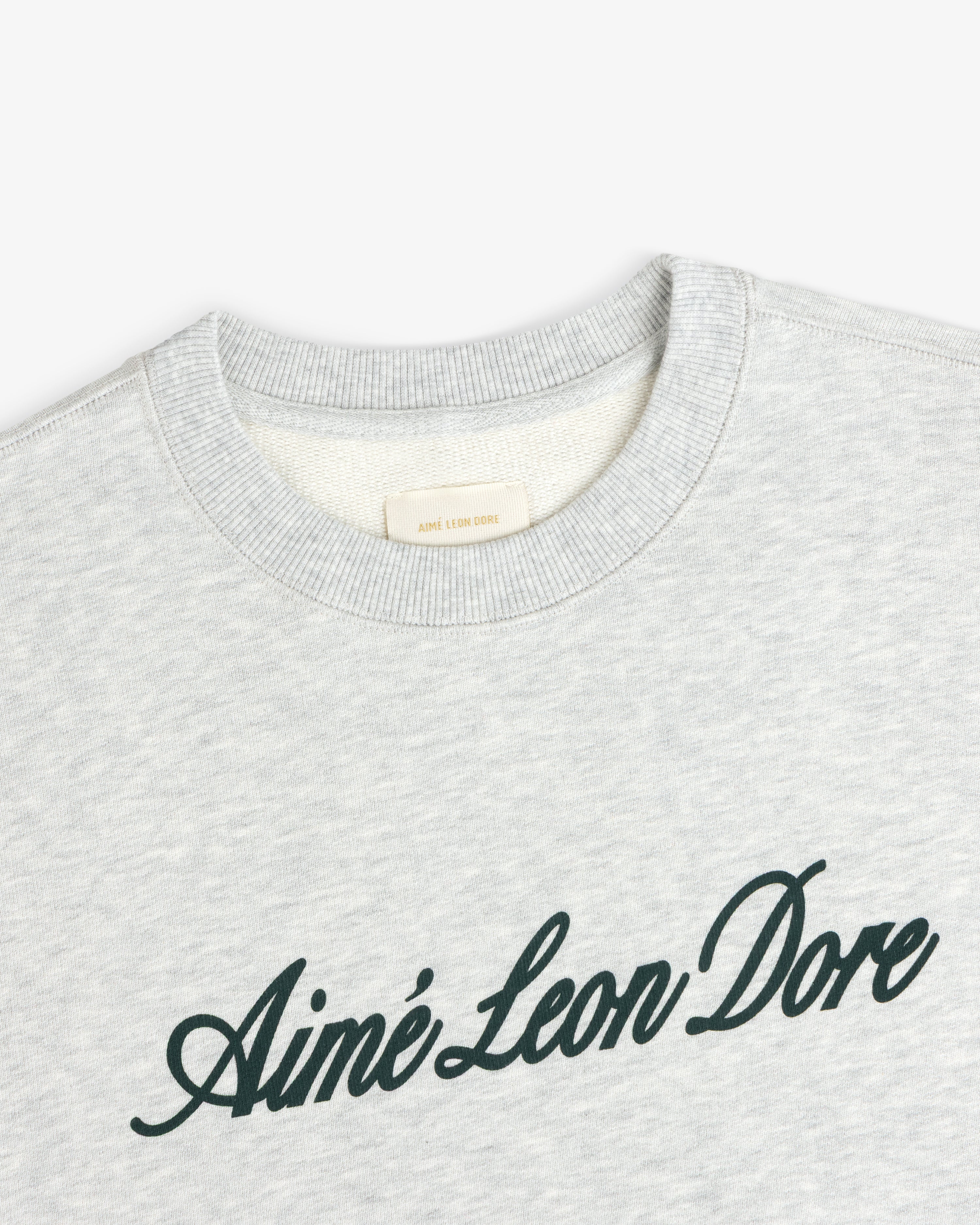 Light gray Vintage Script Crewneck Sweatshirt with Aimé Leon Dore in black script across the chest.