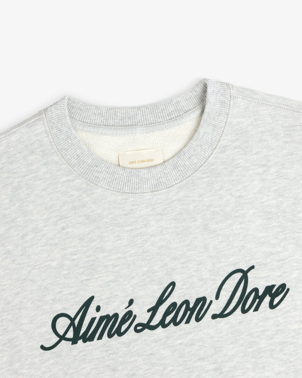 Light gray Vintage Script Crewneck Sweatshirt with Aimé Leon Dore in black script across the chest.