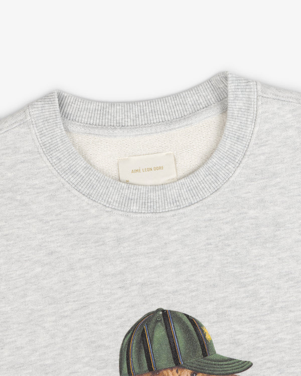 Buddy Crewneck Sweatshirt: light gray, embroidered figure in green cap, Aime Leon Dore label on collar.