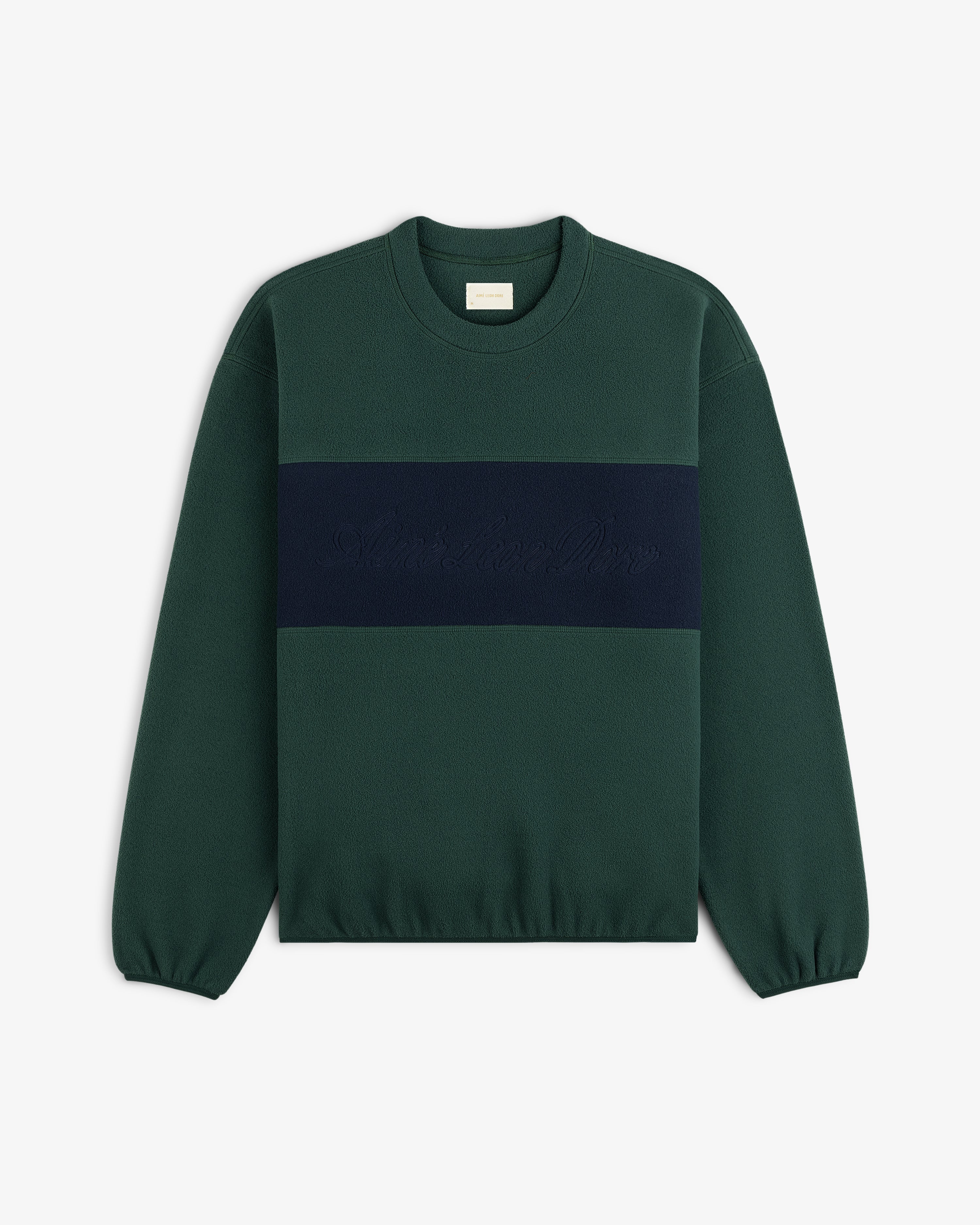 Fleece Script Paneled Crewneck Sweatshirt in dark green with a navy horizontal chest panel featuring embroidered lettering.