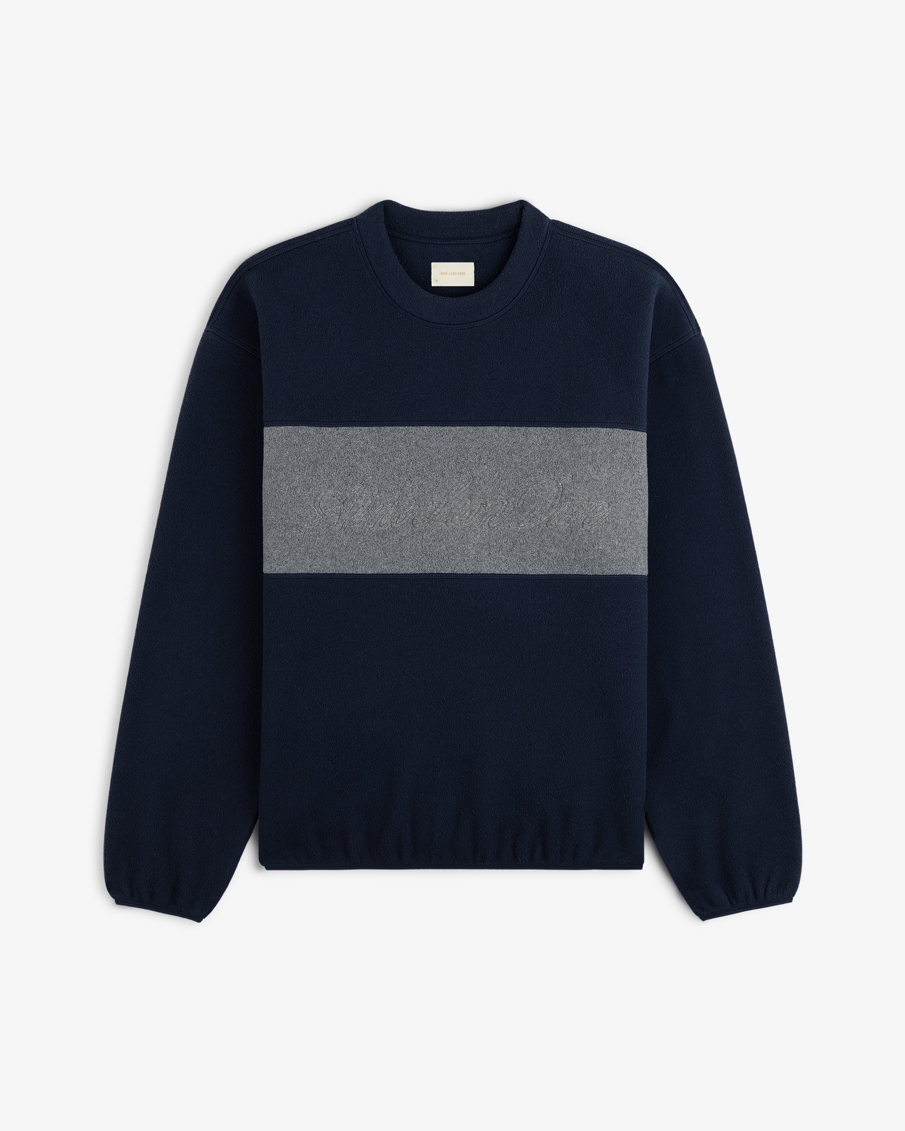Fleece Script Paneled Crewneck Sweatshirt in navy blue with a wide, grey horizontal chest panel and embroidered lettering.