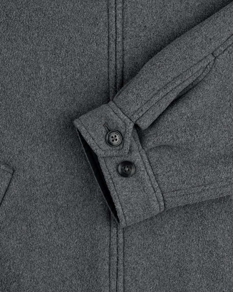 Close-up of Crest Fleece Casual Jacket sleeve in gray, showing two black buttons and a partially visible pocket.