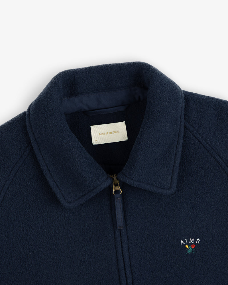 Crest Fleece Casual Jacket in navy blue with zipper, collar, and AIMÉ rose embroidered logo.