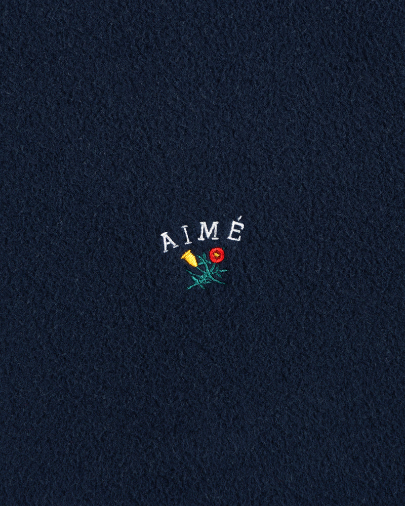 Navy Crest Fleece Casual Jacket with AIMÉ embroidered above a yellow-red flower with green stem and leaves.