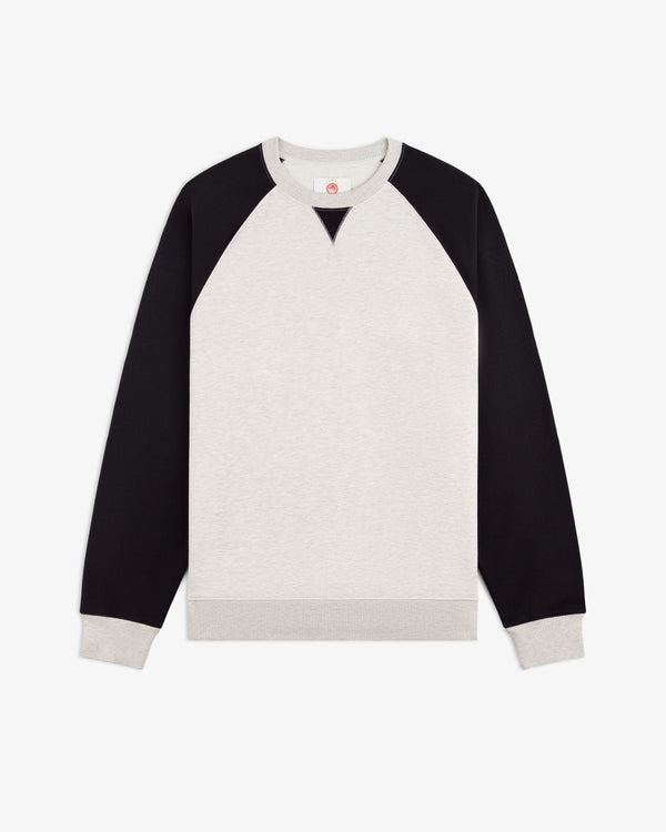 ALD / Olympiacos F.C. Colorblock Crewneck Sweatshirt in light gray with black raglan sleeves and ribbed trim.