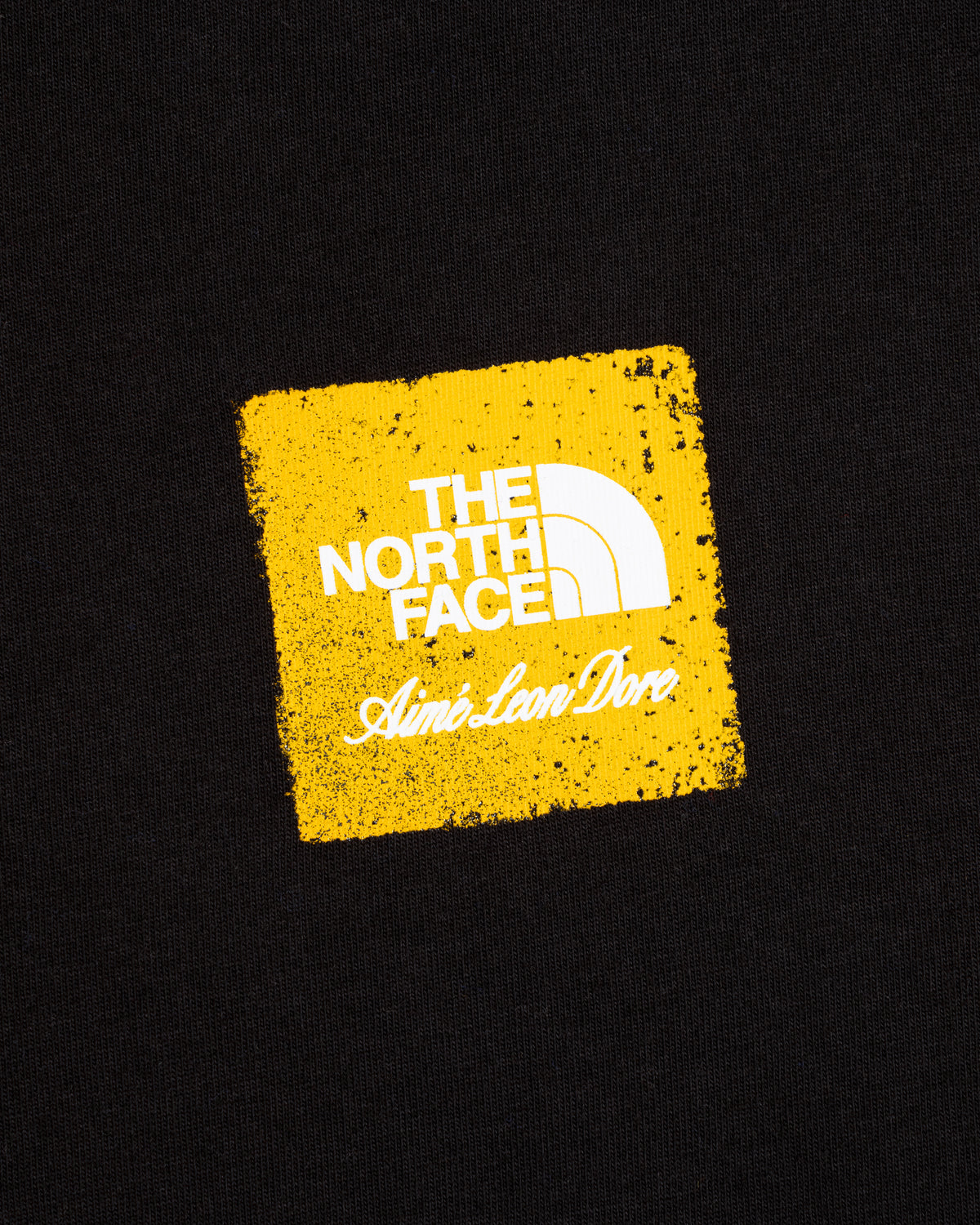 Black ALD / The North Face Logo Tee with yellow square and both brands’ logos.