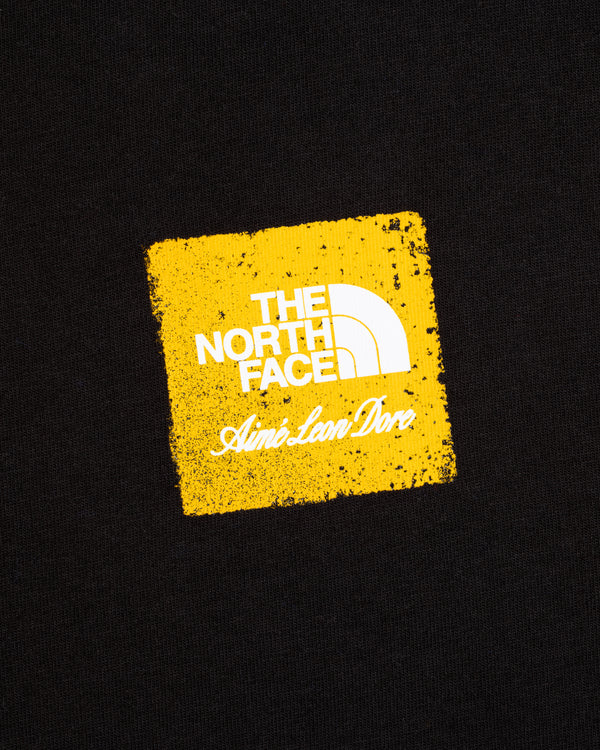 Black ALD / The North Face Logo Tee with yellow square and both brands’ logos.