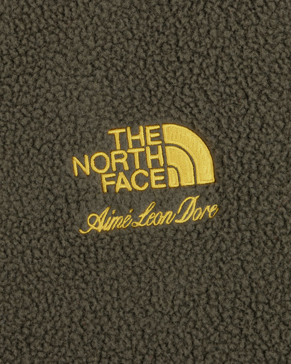 ALD / The North Face Fleece Rugby in yellow logo embroidery on dark textured fleece fabric.