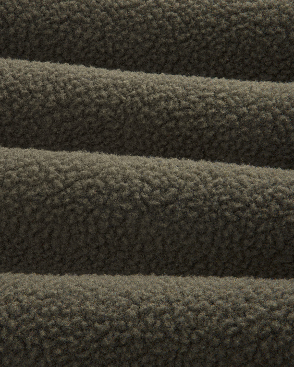 Close-up of ALD/The North Face Fleece Rugby in dark brown, highlighting its soft, textured, and cozy fabric.