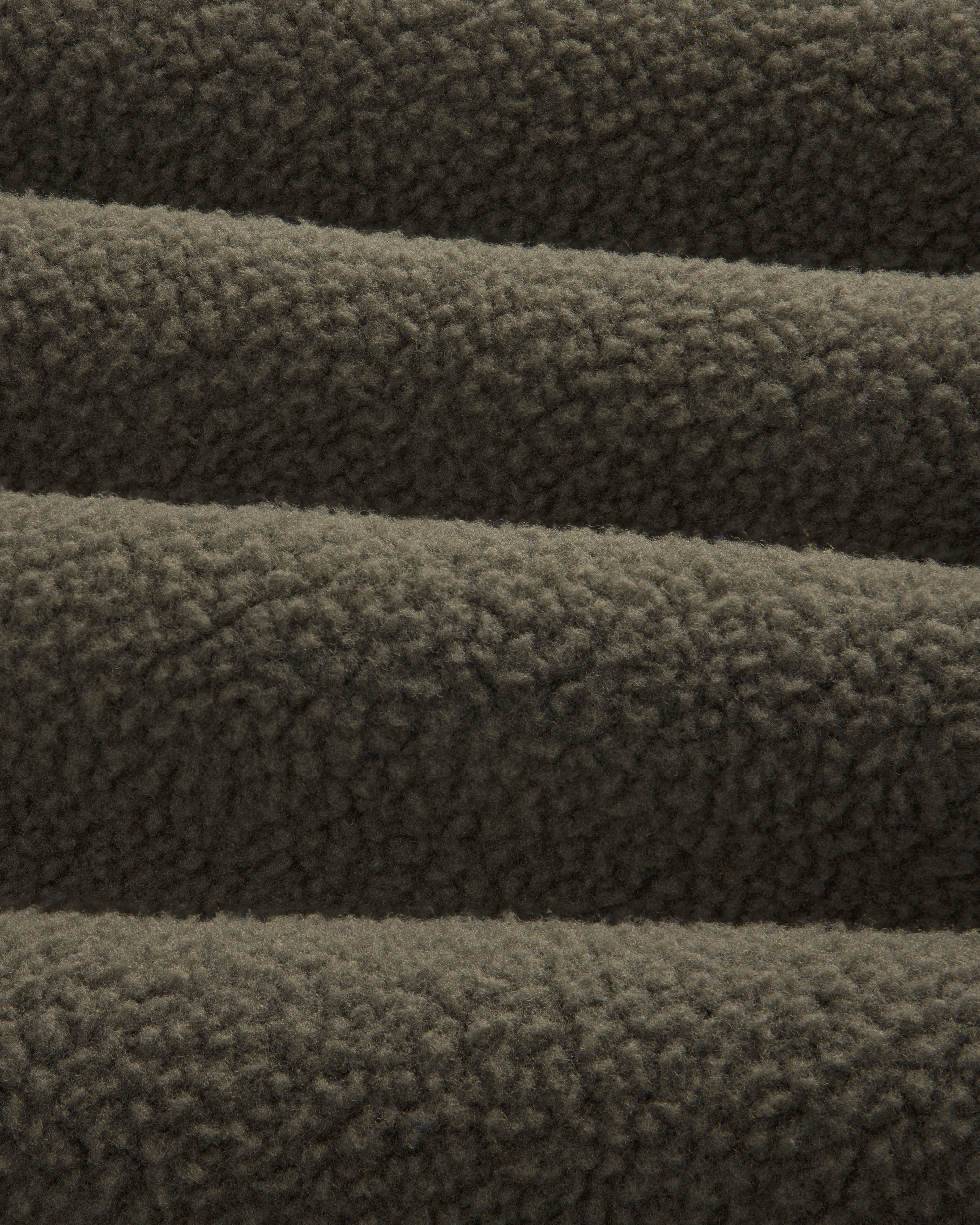 Close-up of ALD/The North Face Fleece Rugby in dark brown, highlighting its soft, textured, and cozy fabric.