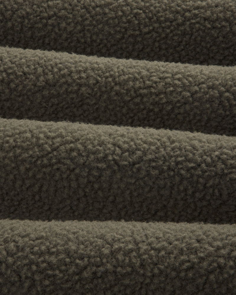 Close-up of ALD/The North Face Fleece Rugby in dark brown, highlighting its soft, textured, and cozy fabric.
