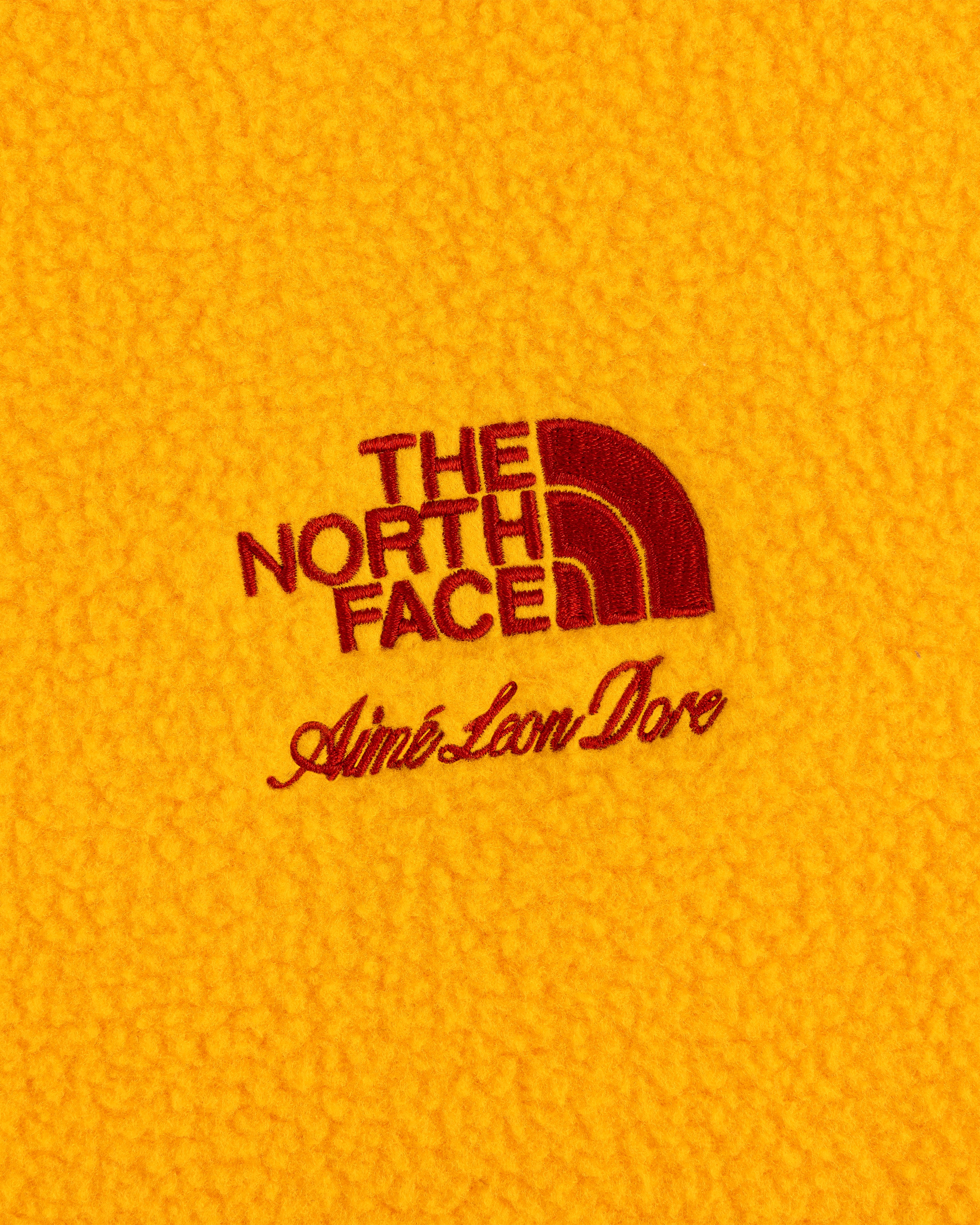 ALD / The North Face Fleece Rugby with red stitched logos on yellow fleece fabric.