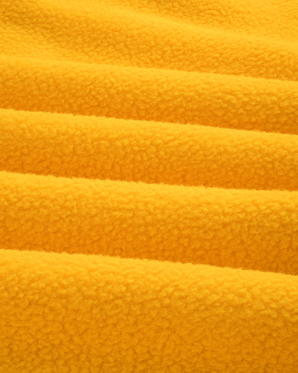 Close-up of ALD / The North Face Fleece Rugby in soft yellow fleece with gentle folds and a fluffy, textured look.