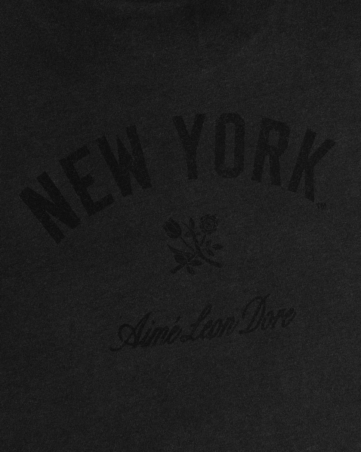 Yankees Washed Logo Tee: Black shirt with NEW YORK, two roses below, and Aimé Leon Dore in script underneath.