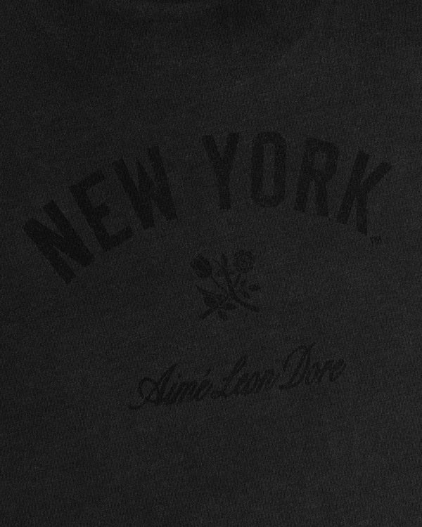 Yankees Washed Logo Tee: Black shirt with NEW YORK, two roses below, and Aimé Leon Dore in script underneath.