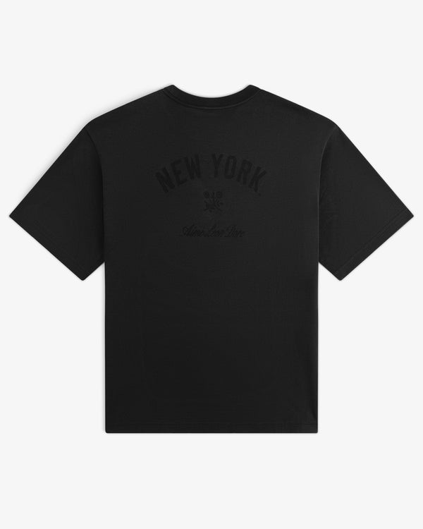 Yankees Washed Logo Tee with NEW YORK and subtle graphics printed in dark ink on the back.