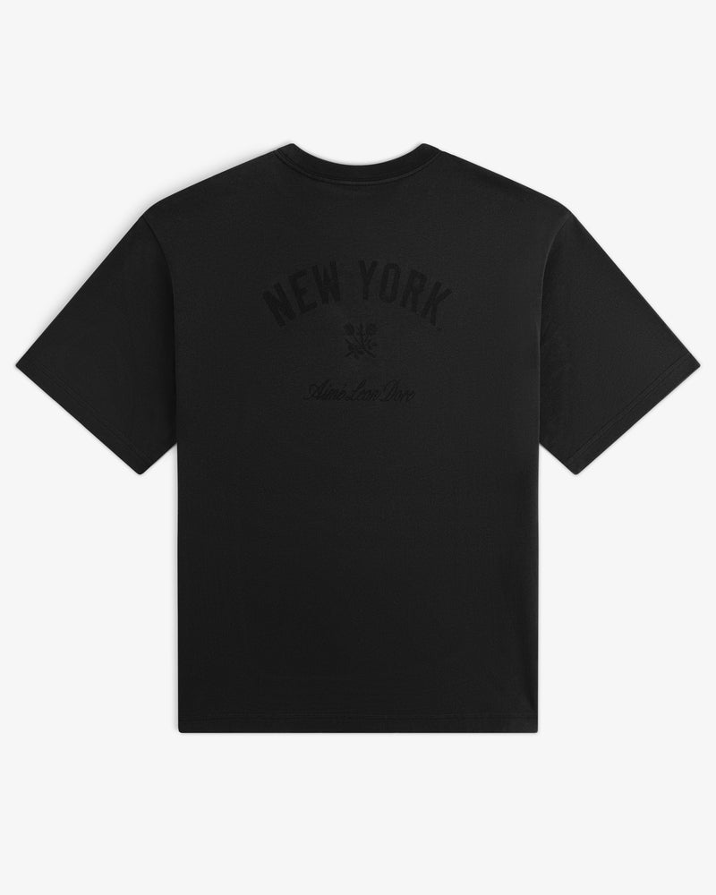 Yankees Washed Logo Tee with NEW YORK and subtle graphics printed in dark ink on the back.