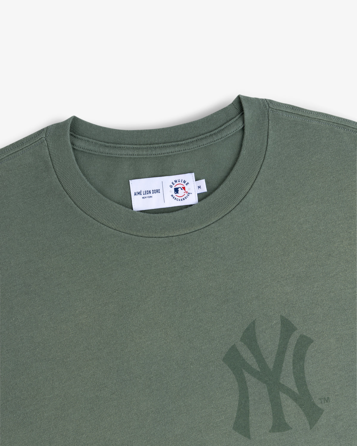 Yankees Washed Logo Tee in green with a subtle NY logo and a visible inner collar label.
