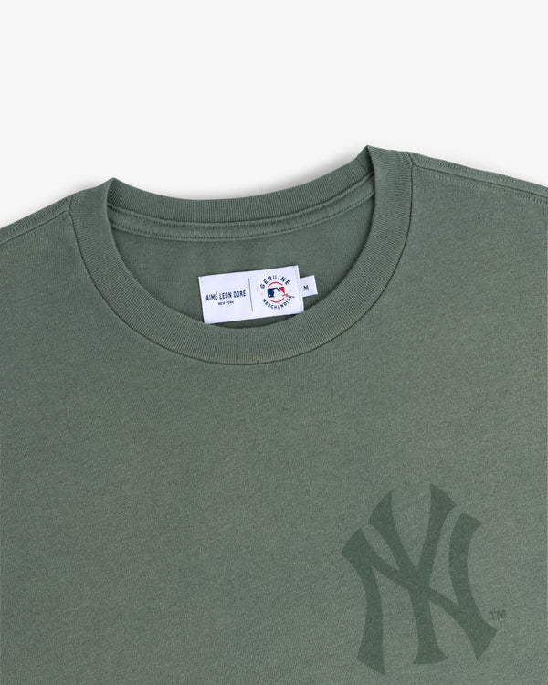 Yankees Washed Logo Tee in green with a subtle NY logo and a visible inner collar label.