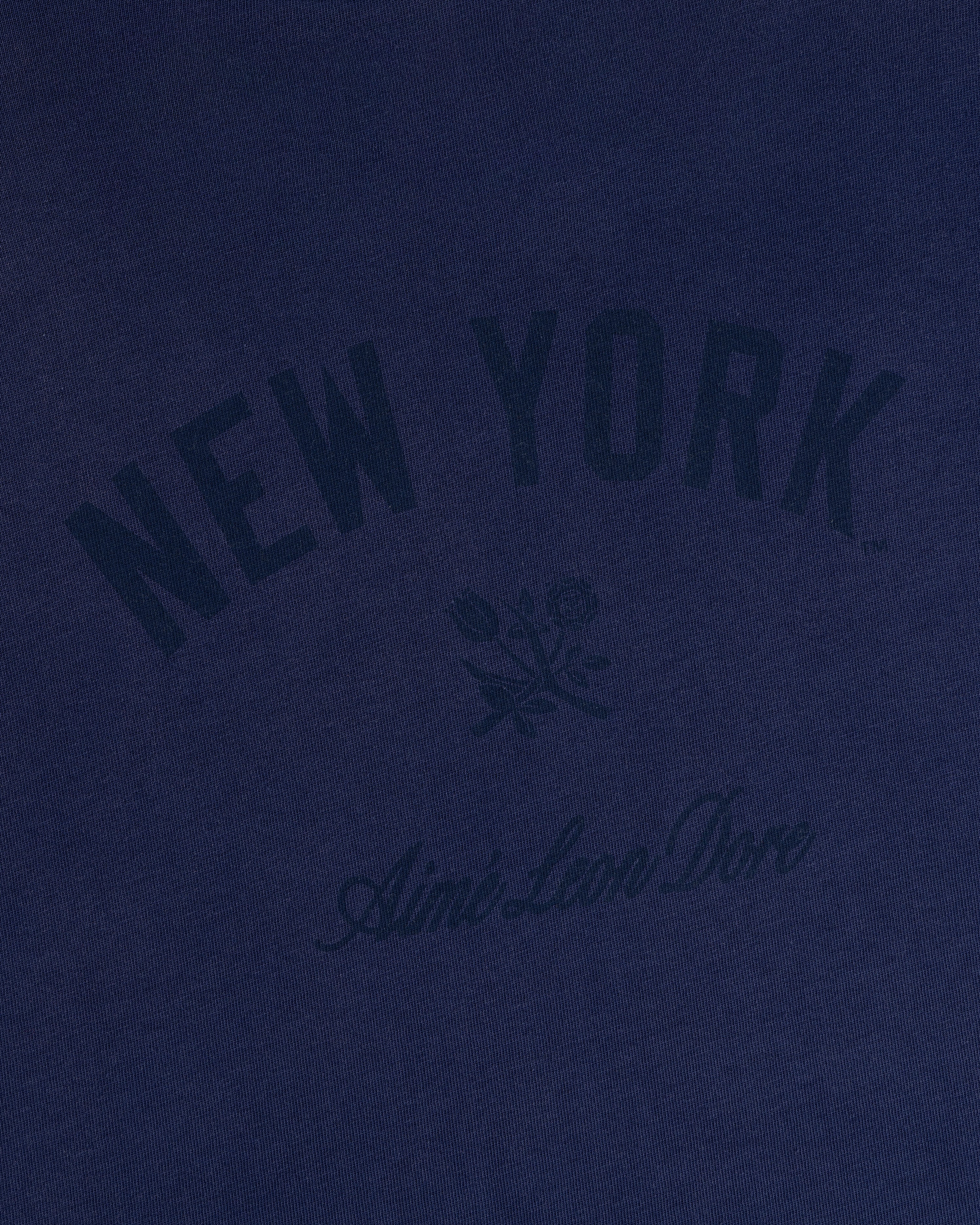 Yankees Washed Logo Tee in navy with NEW YORK, Aimé Leon Dore text, and a small rose graphic at the center.
