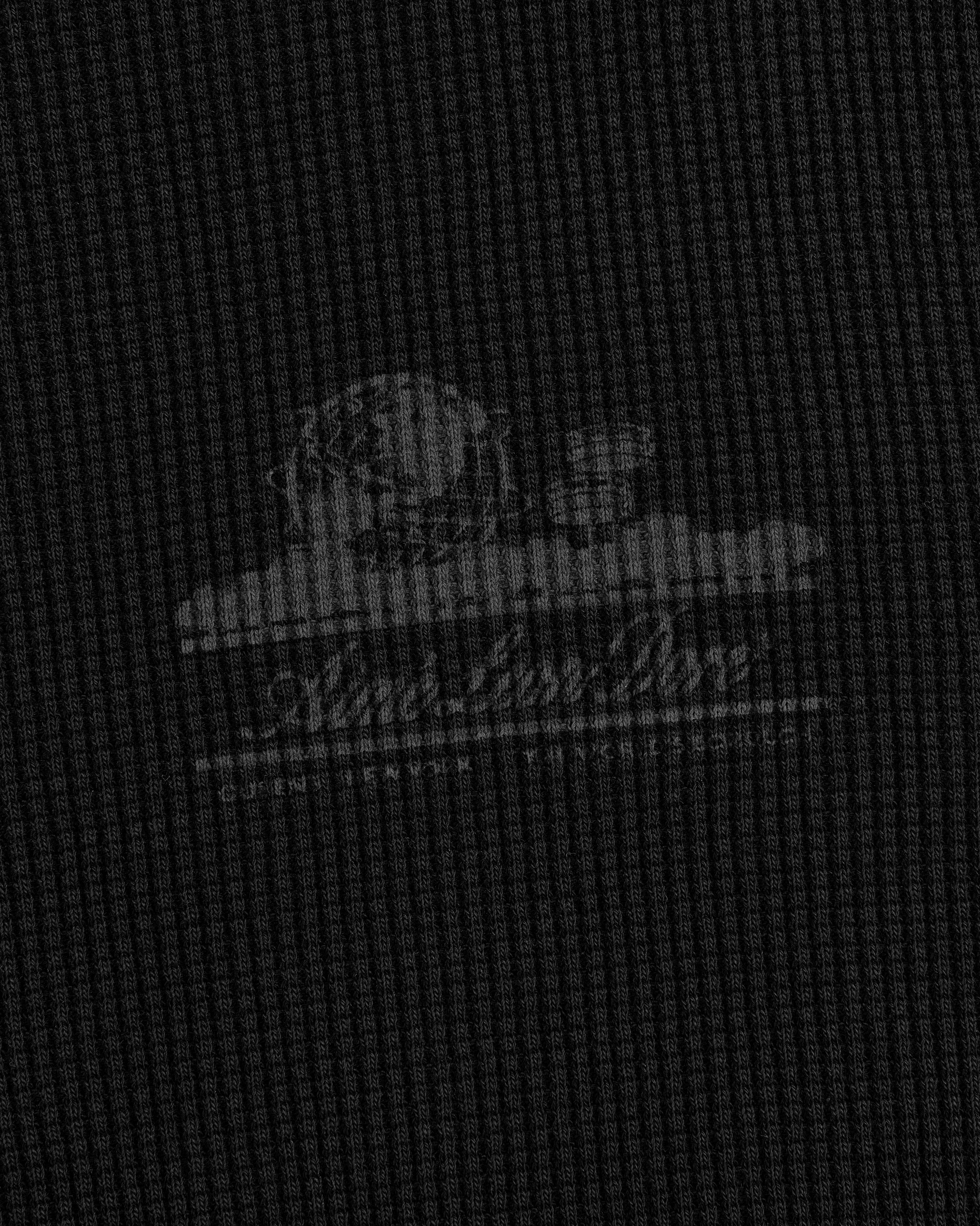 Faint white Unisphere logo and text on a dark, textured waffle thermal with grid pattern and cloud accents.