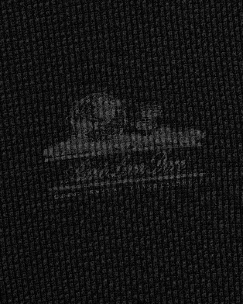 Faint white Unisphere logo and text on a dark, textured waffle thermal with grid pattern and cloud accents.