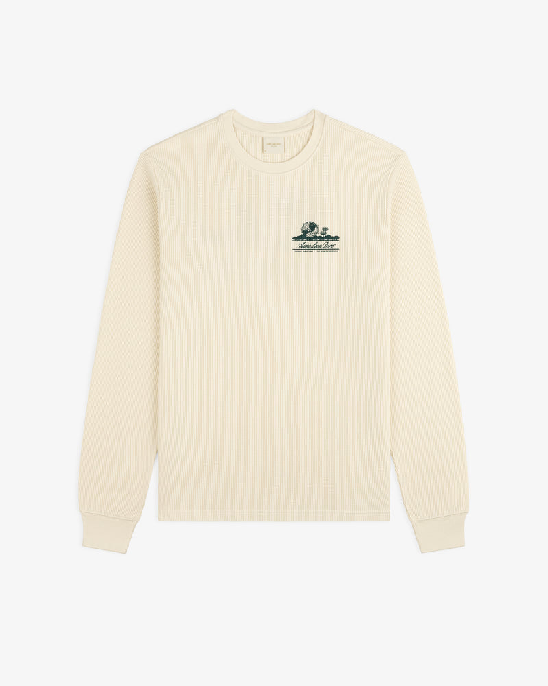 Ivory Long-Sleeve Unisphere Waffle Thermal with a small green embroidered graphic on the upper left chest.