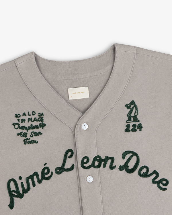 Mulberry Chainstitch Baseball Jersey with dark green embroidery, text, numbers, and a bear patch on the chest.