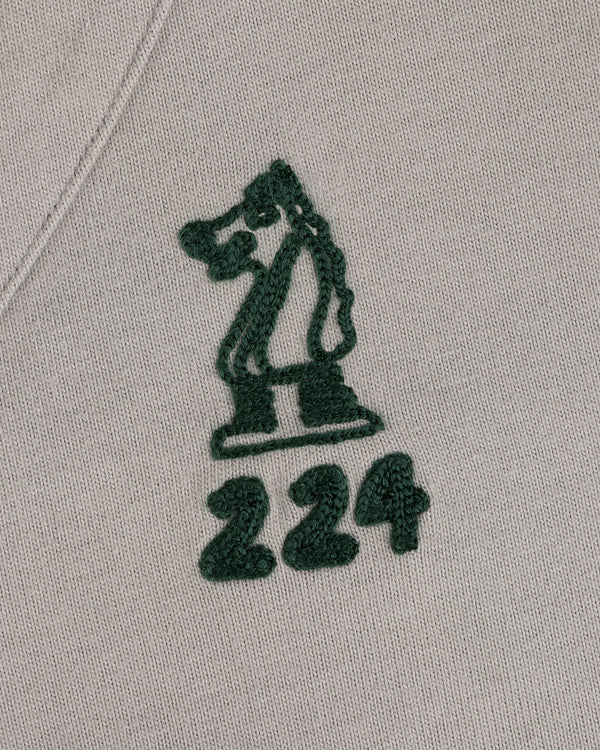 Mulberry Chainstitch Baseball Jersey with a green chess knight and 224 embroidered on light beige fabric.