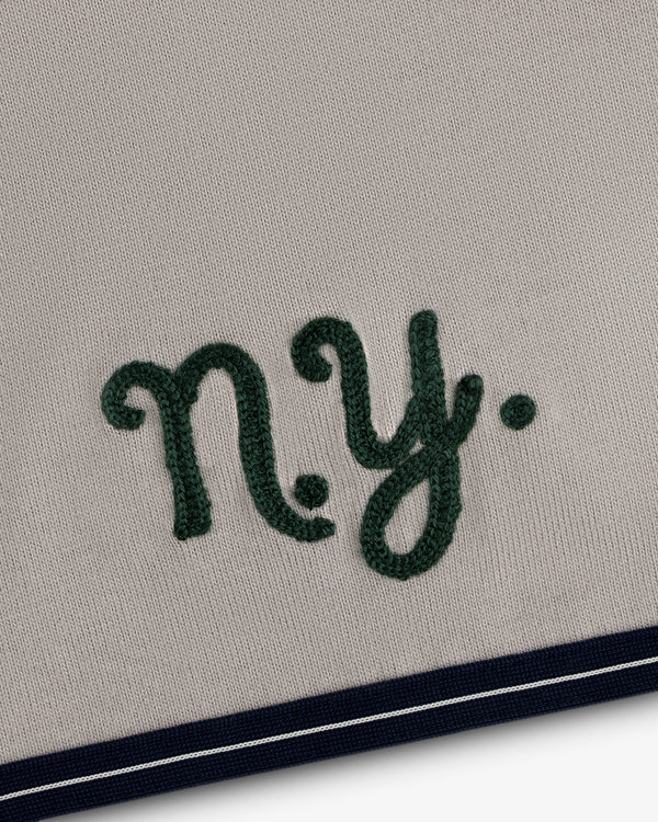 Mulberry Chainstitch Baseball Jersey: Green “ny.” on beige, navy/white striped border at bottom.
